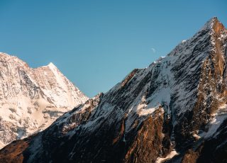 Breathtaking view of snow-covered Himalayan peaks under a clear sky, Nepal.