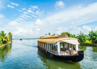 brown wooden boat on water during daytime